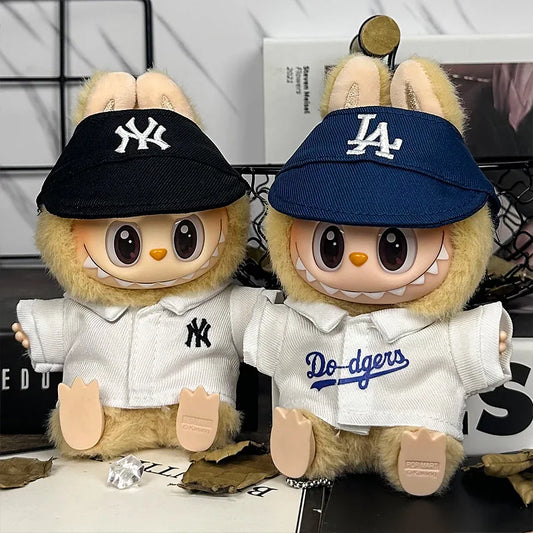 Labubu wearing New York Yankees and Los Angeles Dodgers hats and jerseys.